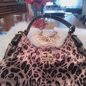 Cheetah print coach carrying bag